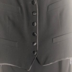 Ladies tuxedo style dress with attached vest.